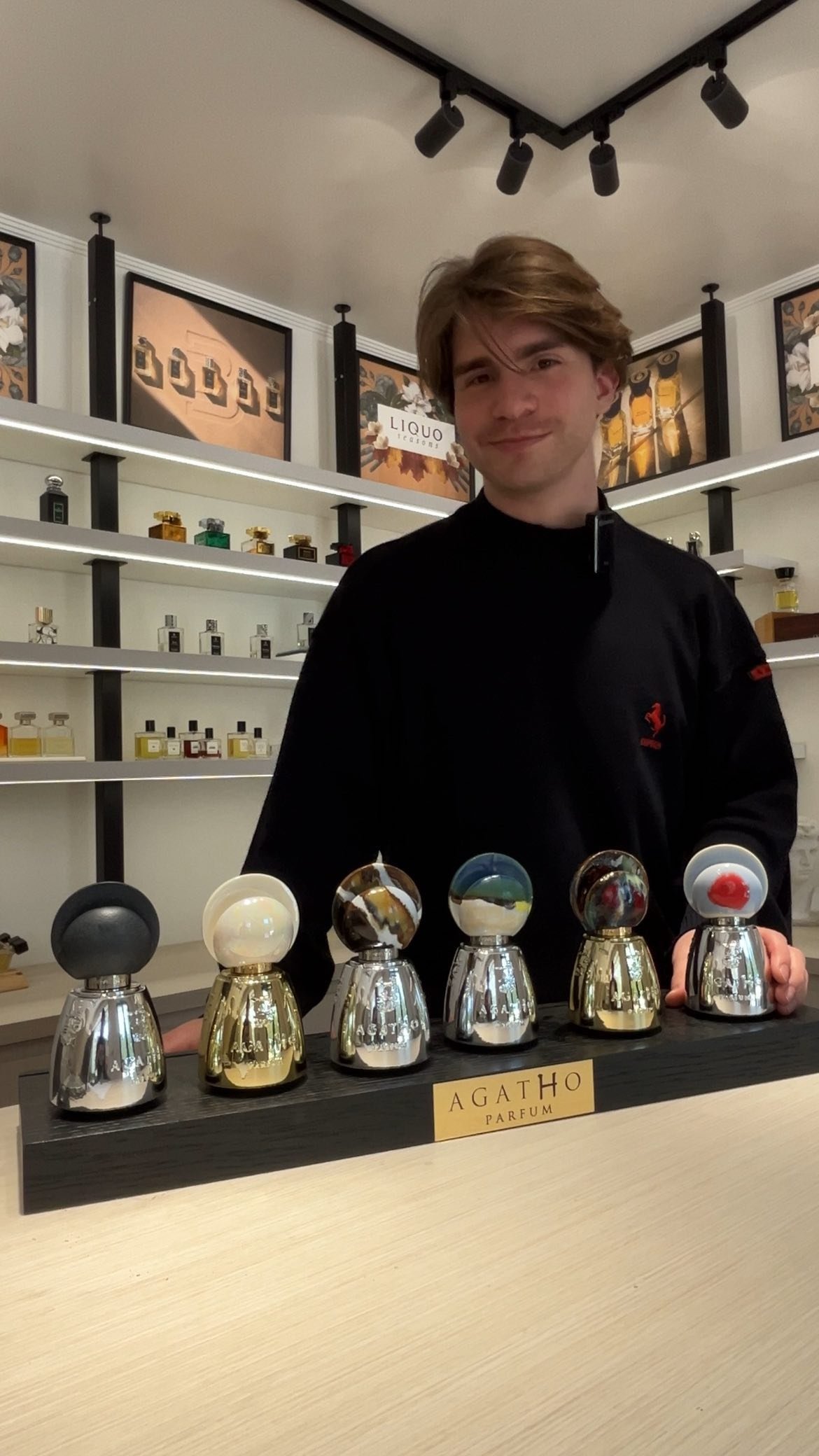 Rodrigo at LIQUO presenting a selection of niche fragrances on the counter