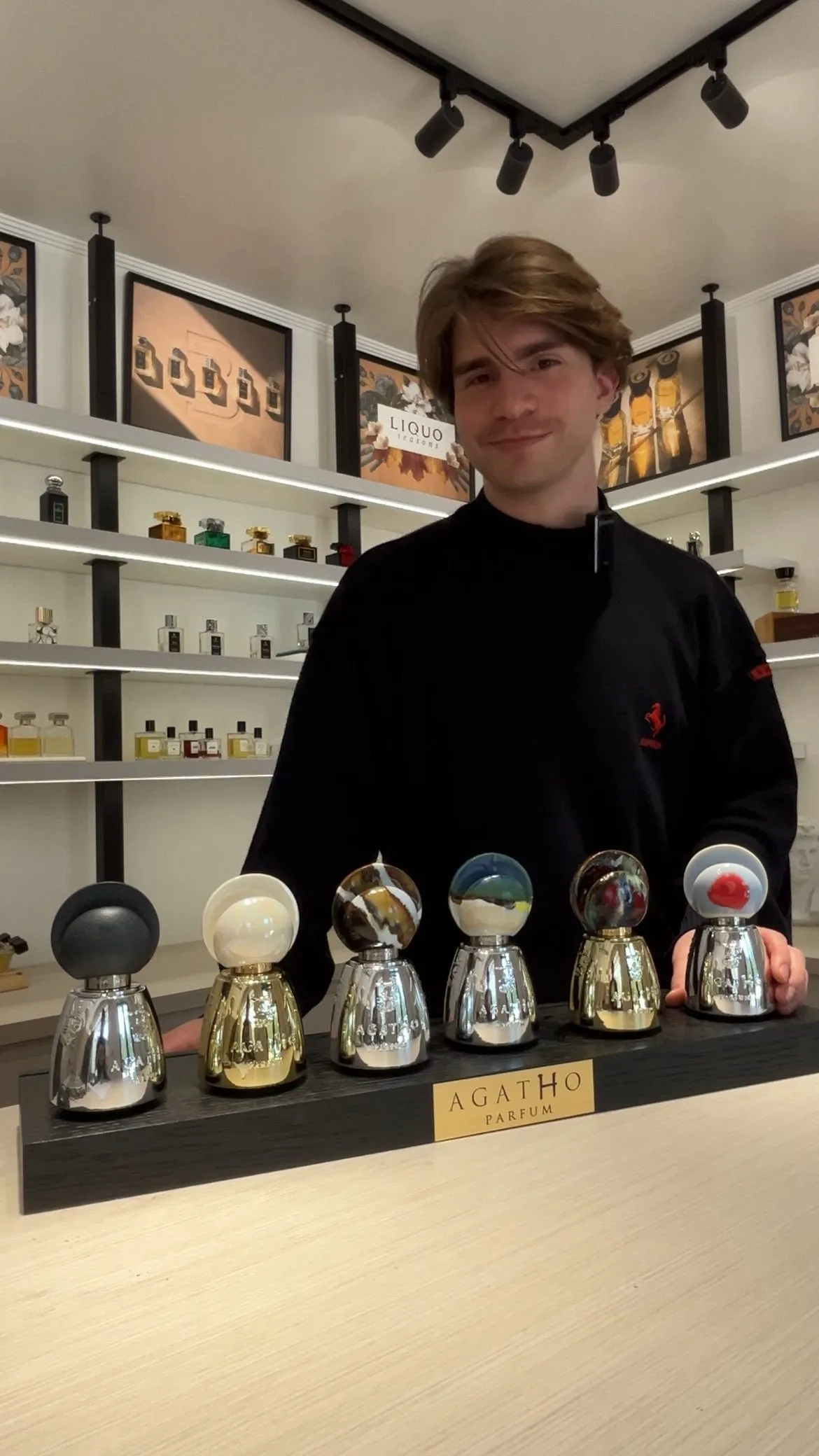 Rodrigo at LIQUO presenting a selection of niche fragrances on the counter