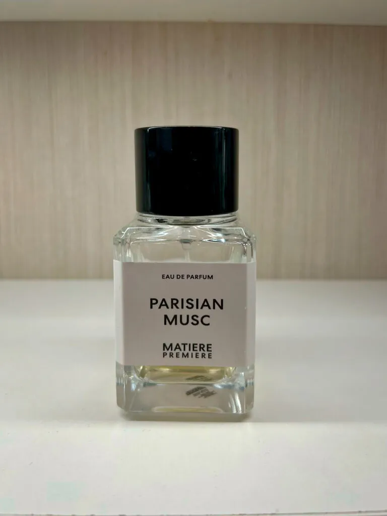 Front-facing photo of Matière Première Parisian Musc perfume bottle with minimalist white label and black cap