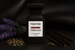 Tom Ford F***ing Fabulous perfume bottle with lavender, clary sage buds, and vanilla pods on a dark leather background, highlighting its rich and bold fragrance composition.