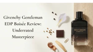 Givenchy Gentleman EDP Boisée bottle in a minimalist editorial scene with iris, cocoa and woods