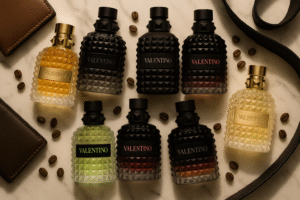 Valentino Perfumes Buying Guide for Men featuring Uomo, Uomo Intense, Uomo Noir Absolu, and Born in Roma fragrances in a luxury flat lay.