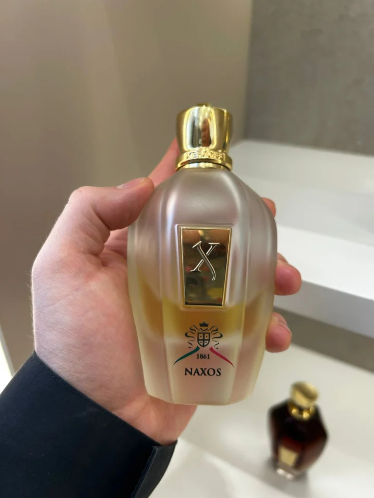 Naxos by Xerjoff fragrance bottle with gold cap and frosted glass design