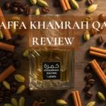 Lataffa Khamrah Qahwa bottle with coffee beans, cardamom, and cinnamon on a rustic table.