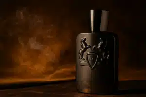 Herod by Parfums de Marly perfume bottle in cinematic lighting on dark suede background with warm amber light and subtle smoke, editorial Liquo photography.