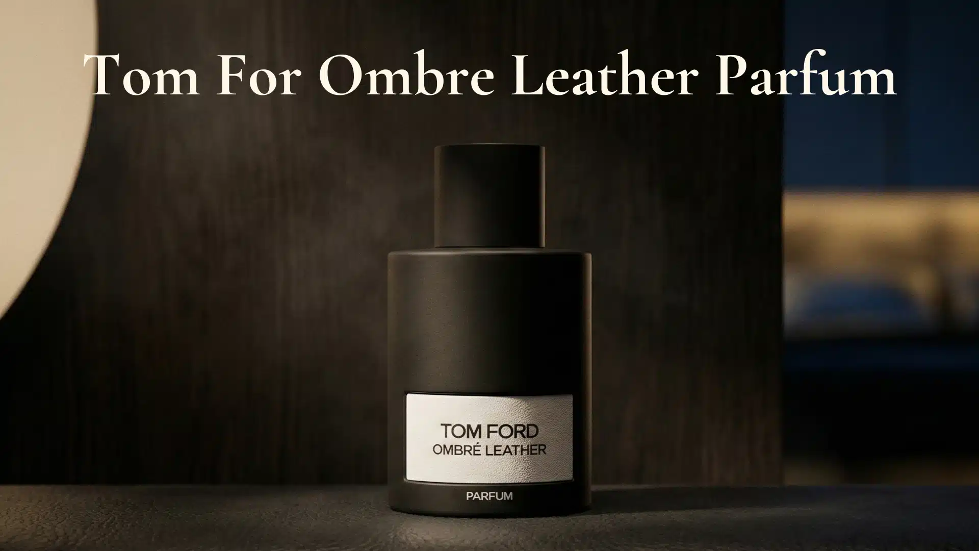 Low-light editorial hero image of Tom Ford Ombre Leather Parfum on a dark matte surface with deep shadows.