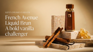 French Avenue Liquid Brun perfume styled on travertine stone with vanilla and spice in an editorial fragrance review setting