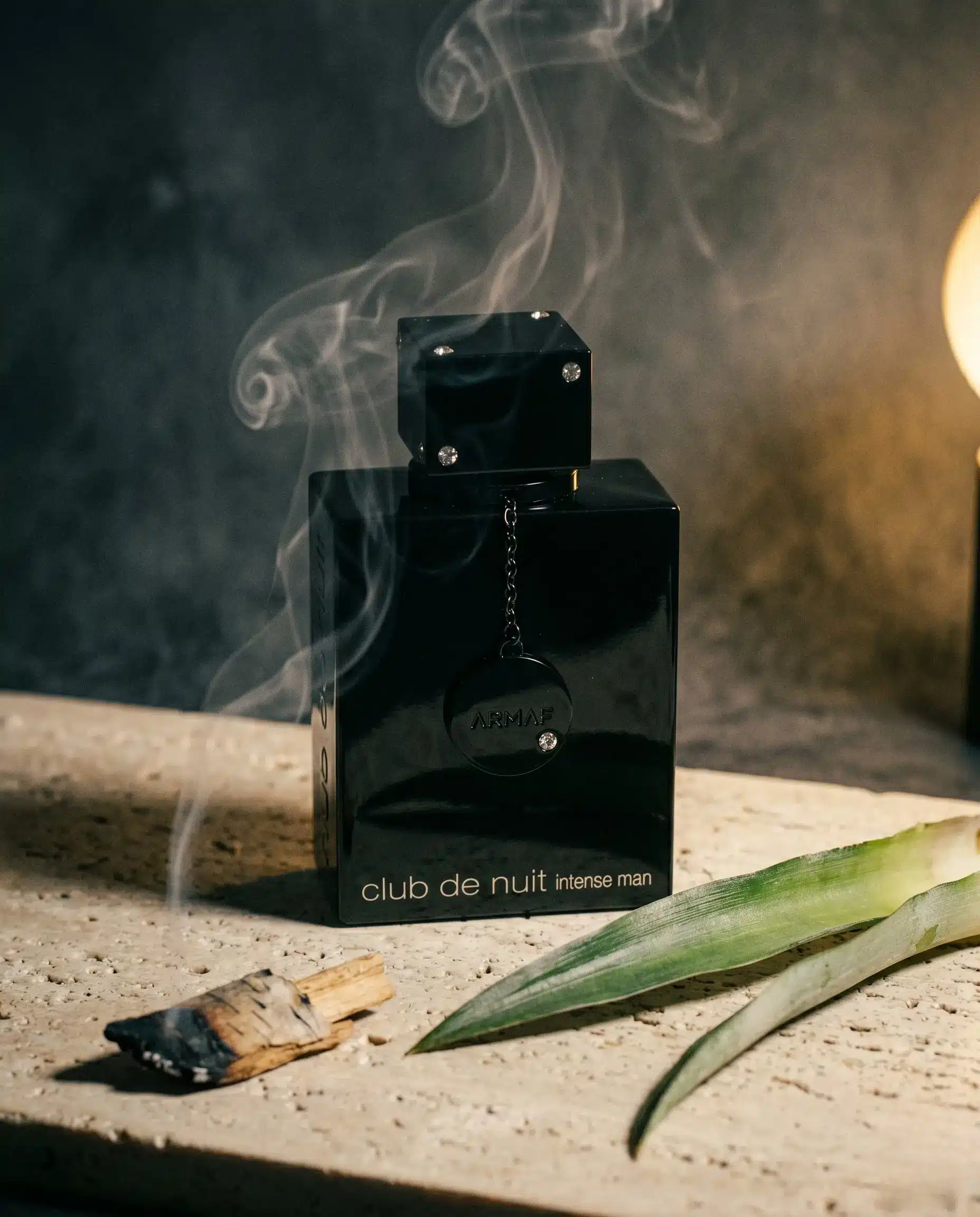 Armaf Club de Nuit Intense Man bottle with pineapple frond and smoky birch